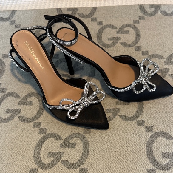 BCBGeneration Black Heels with Silver Bow Accents - Picture 1 of 2